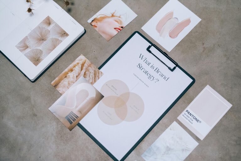 Flat lay showing branding materials and design concepts for creative strategy discussions.